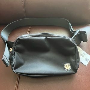 Black and Gold Lululemon belt bag
